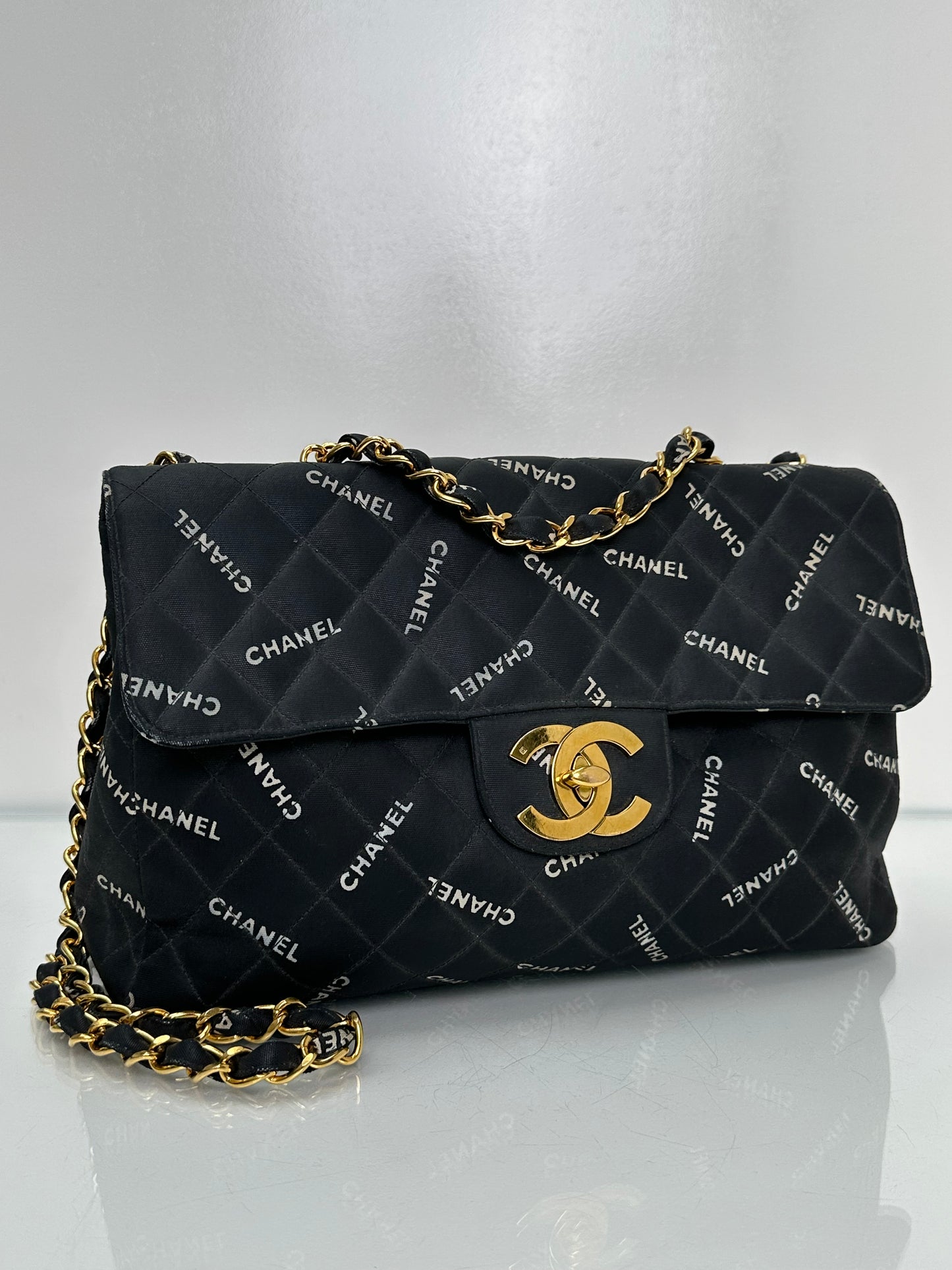 Chanel 1995 Black Canvas “Chanel” Single Flap Maxi Bag 24KGHW