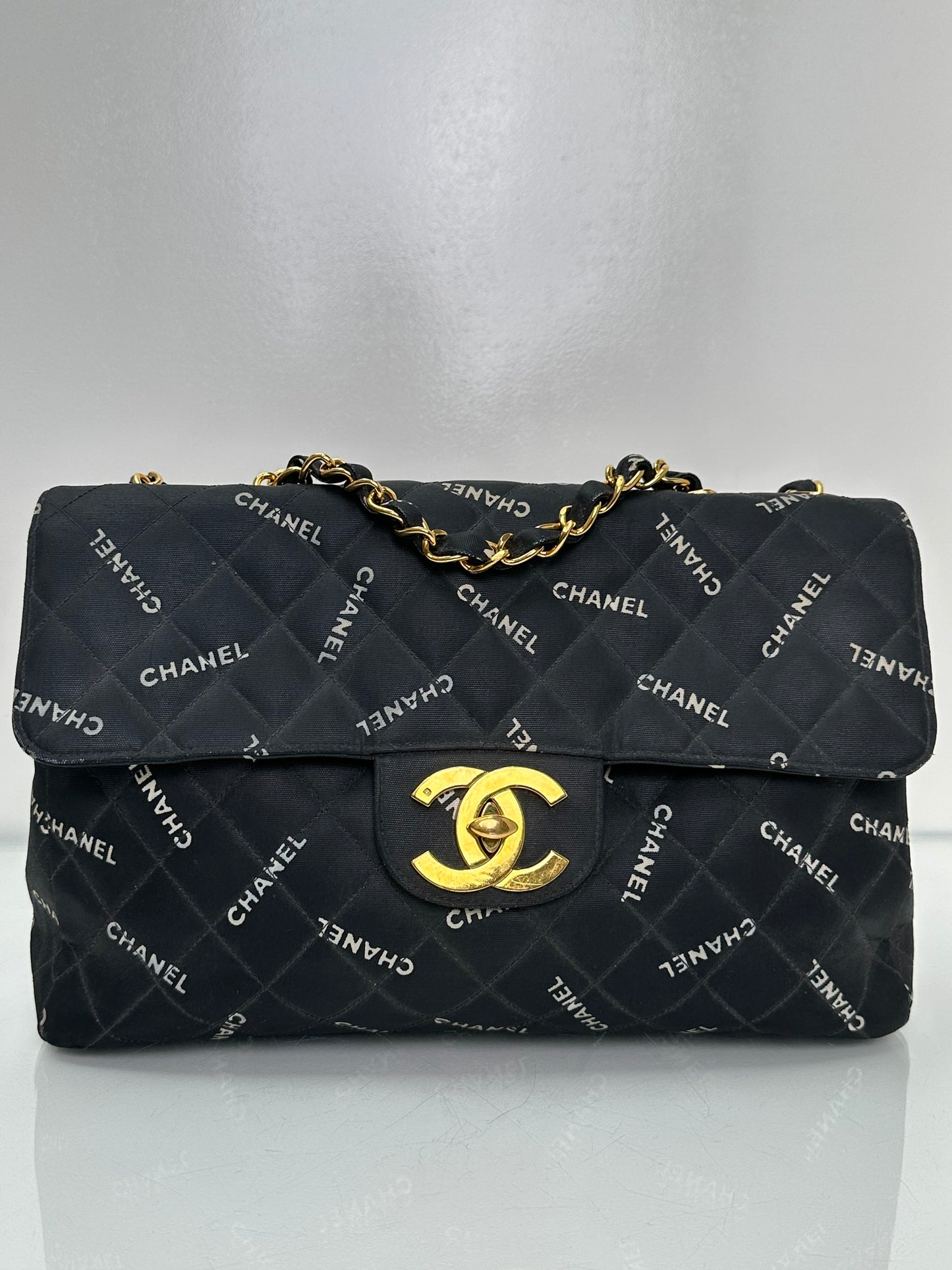 Chanel 1995 Black Canvas “Chanel” Single Flap Maxi Bag 24KGHW