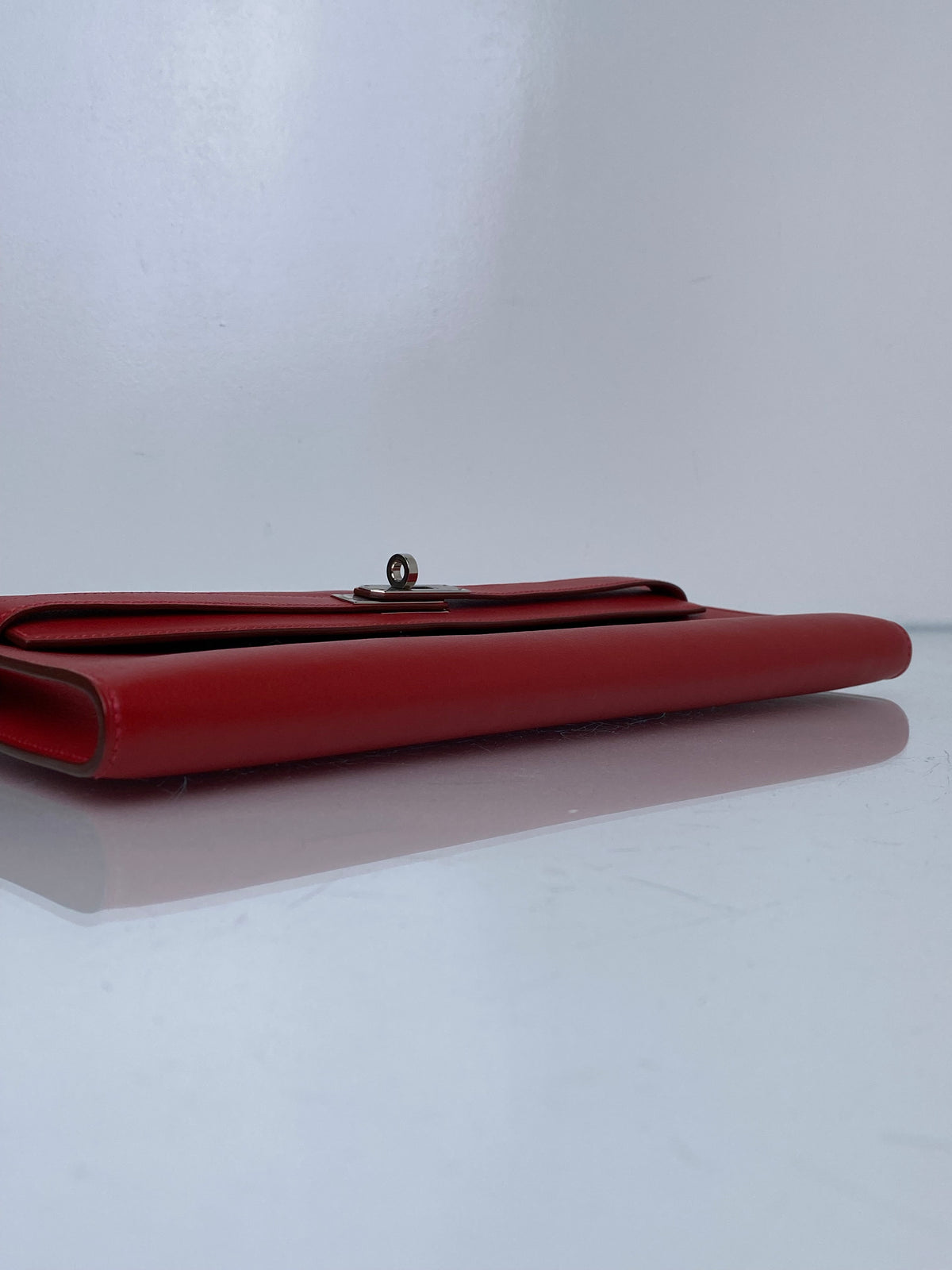 Hermes Kelly Cut Pochette Rouge Casaque Swift PHW #M