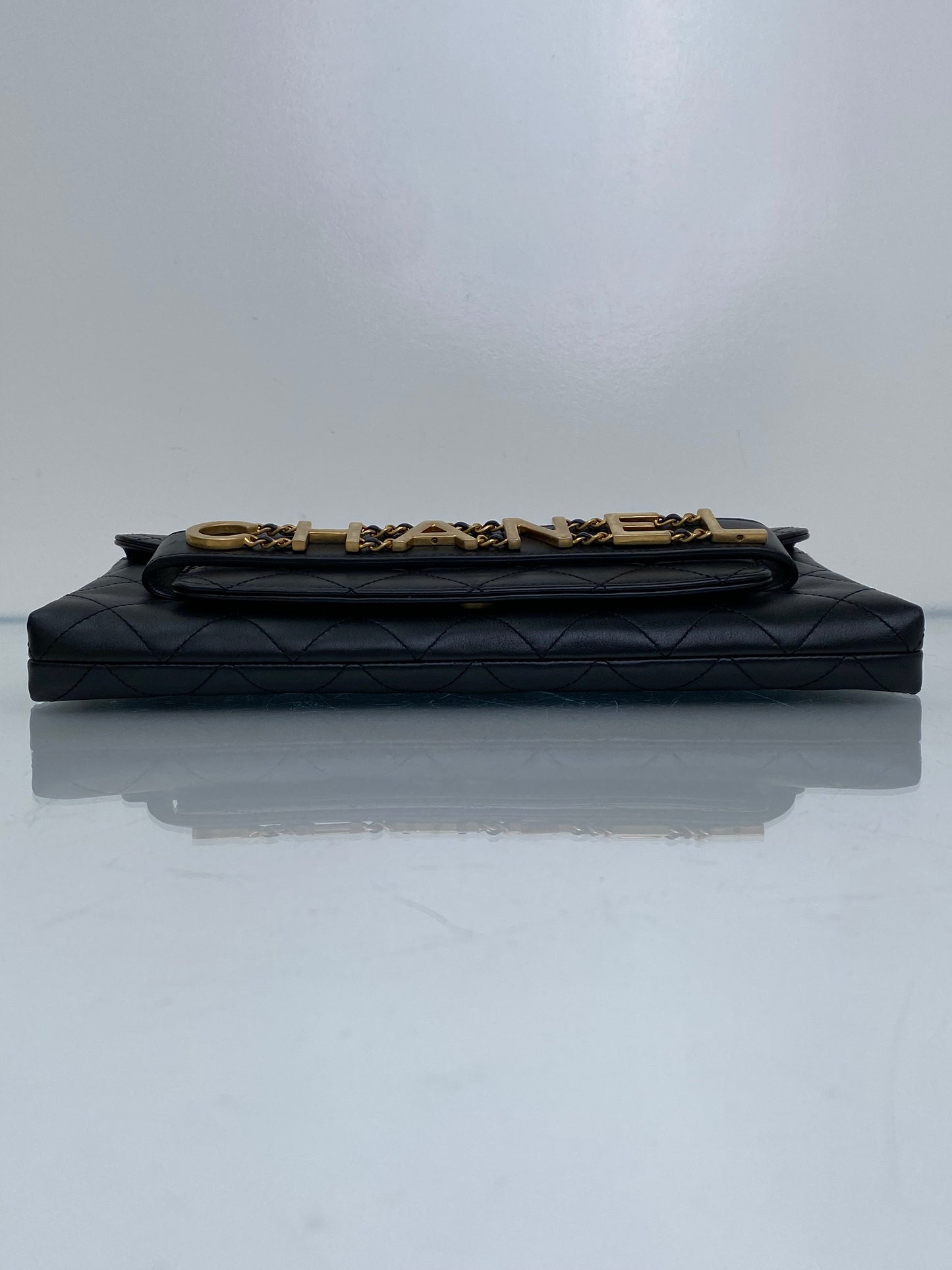 Chanel Black Logo Enchained Flap Quilted Calfskin Clutch GHW