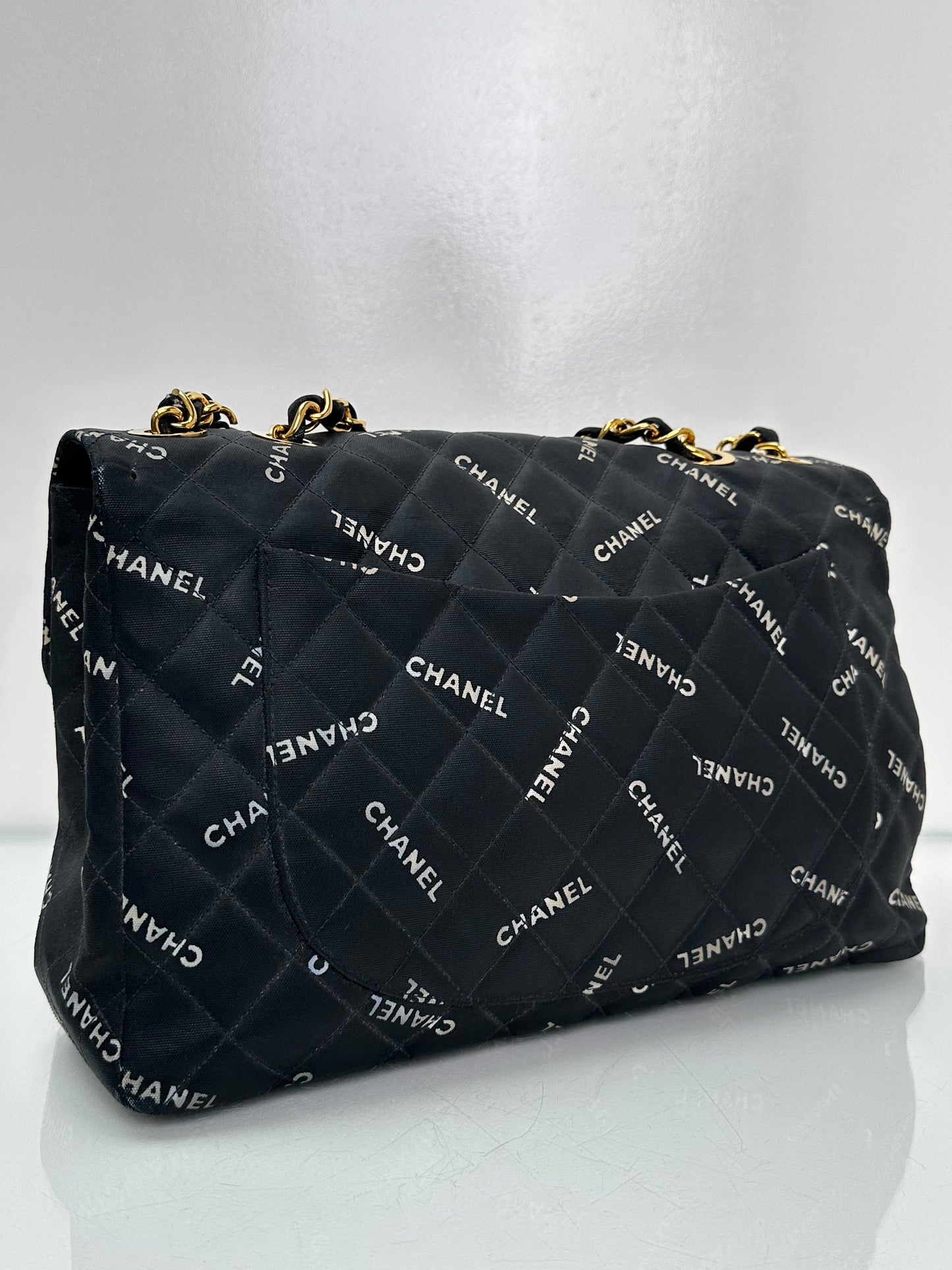 Chanel 1995 Black Canvas “Chanel” Single Flap Maxi Bag 24KGHW